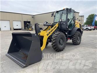 New Holland W80C Gumikerekes homlokrakodók