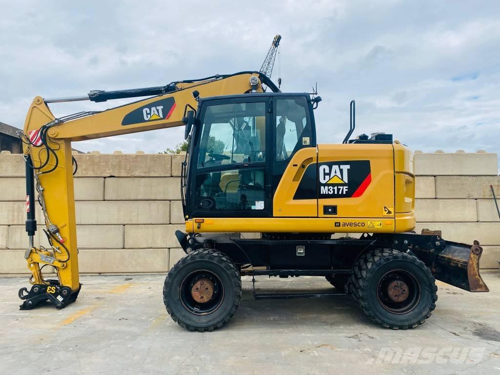 CAT m317f Gumikerekes kotrók
