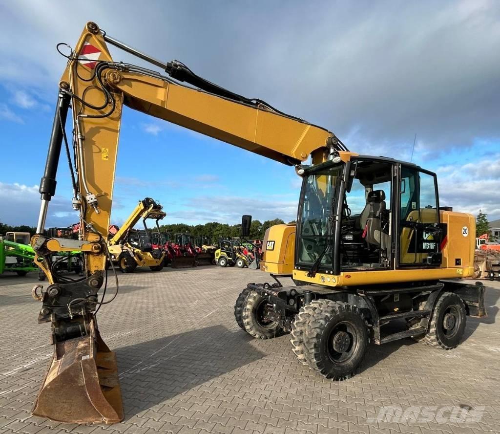 CAT M 318 F Gumikerekes kotrók
