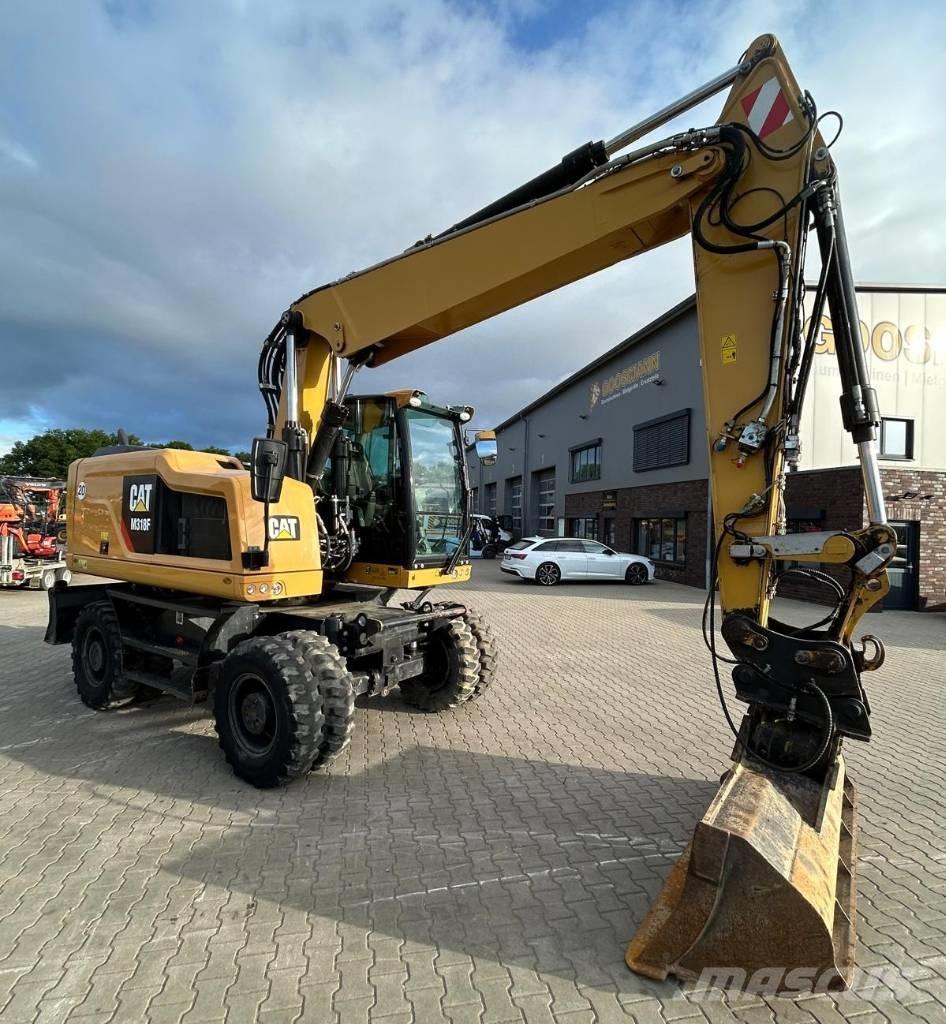 CAT M 318 F Gumikerekes kotrók