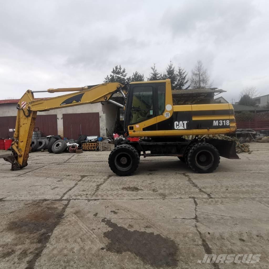 CAT M 318 B Gumikerekes kotrók