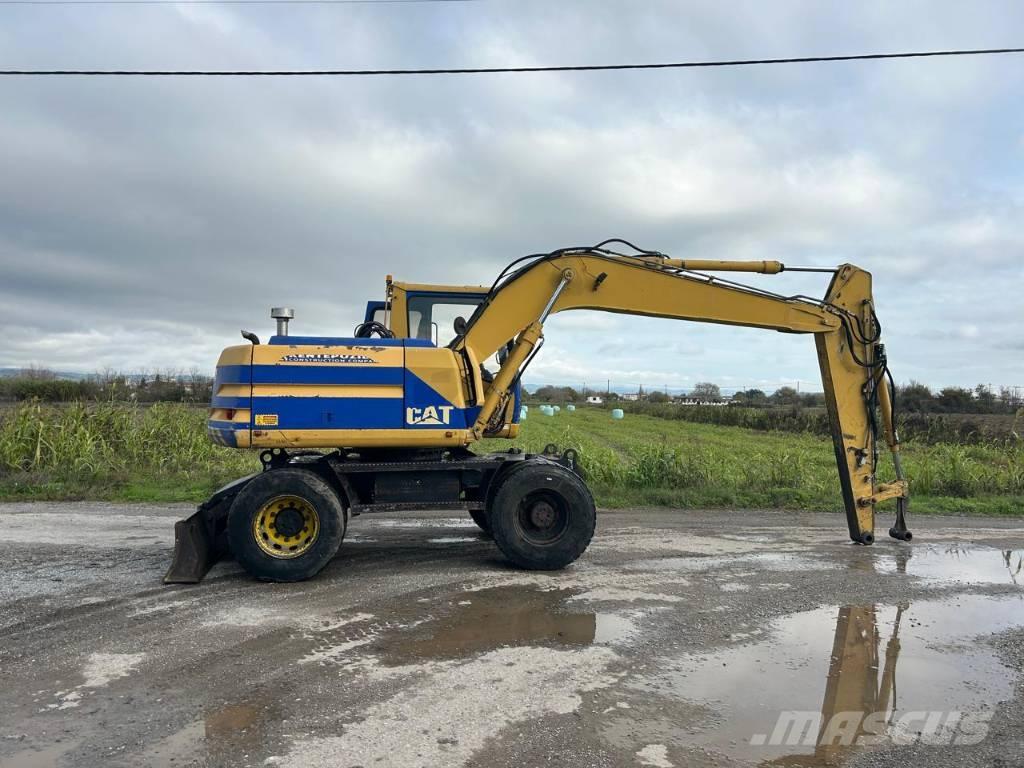 CAT M 312 Gumikerekes kotrók