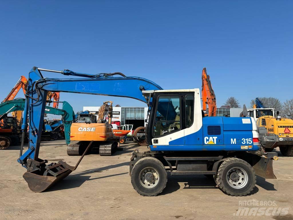 CAT M 315 Gumikerekes kotrók