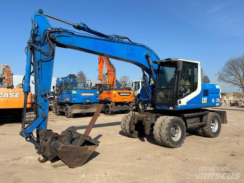 CAT M 315 Gumikerekes kotrók