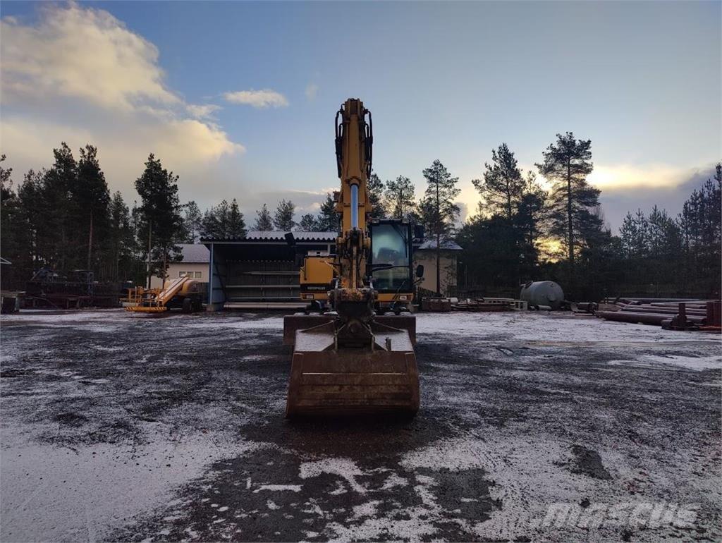 CAT M315 Gumikerekes kotrók