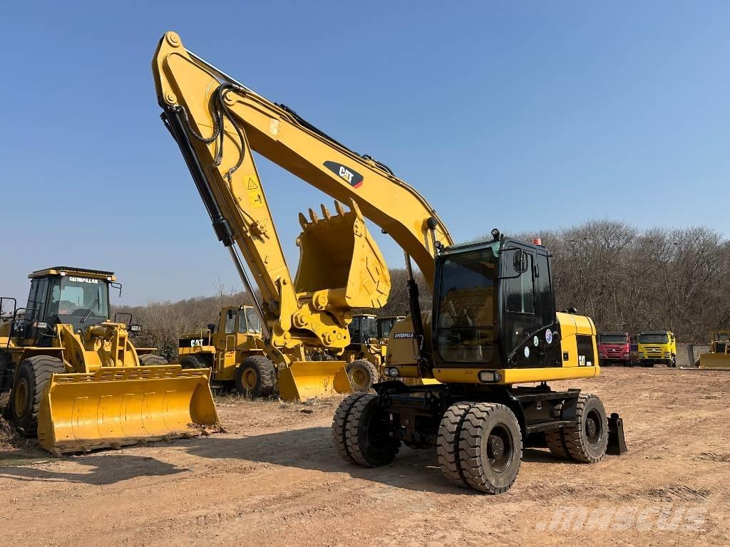 CAT M 320D Gumikerekes kotrók