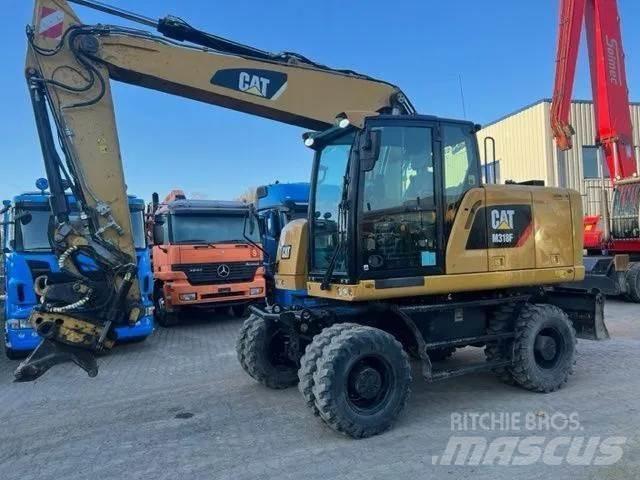 CAT M 318 F Gumikerekes kotrók