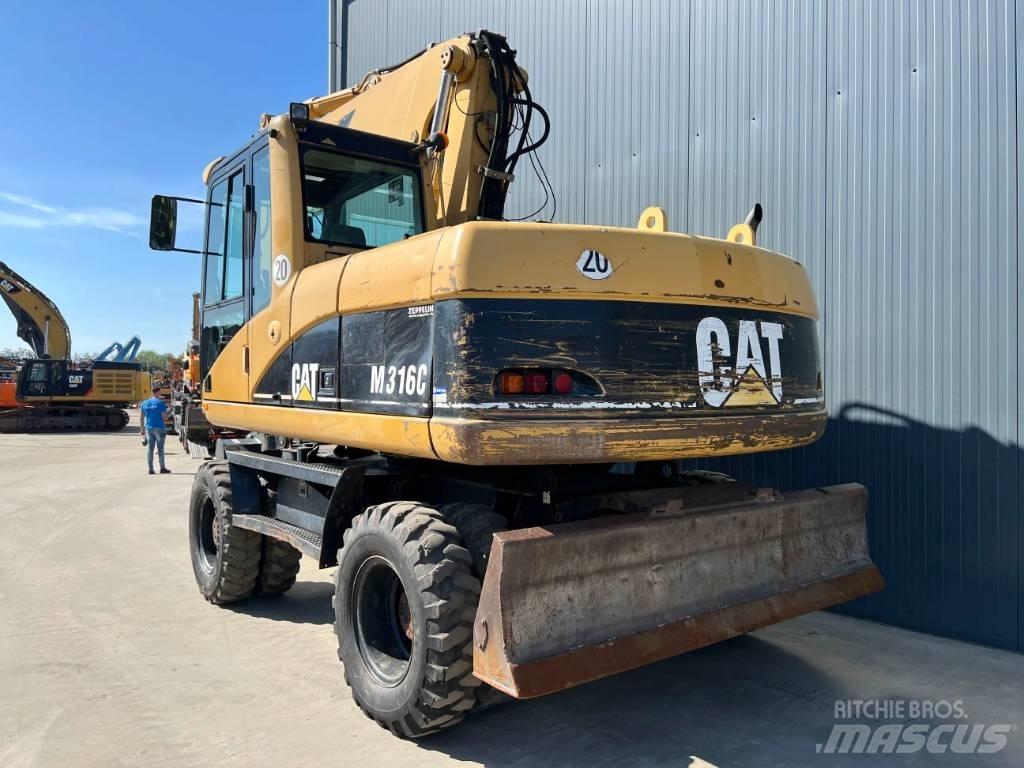CAT M316C Gumikerekes kotrók