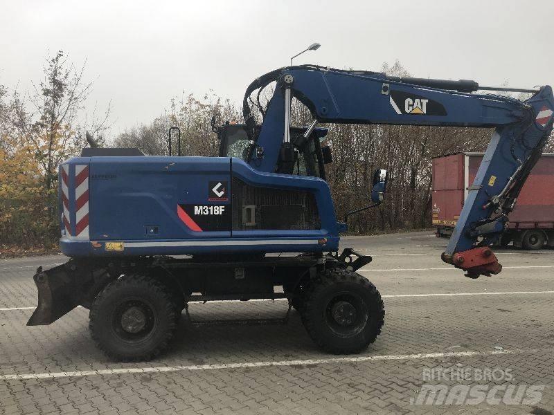 CAT M318F Gumikerekes kotrók