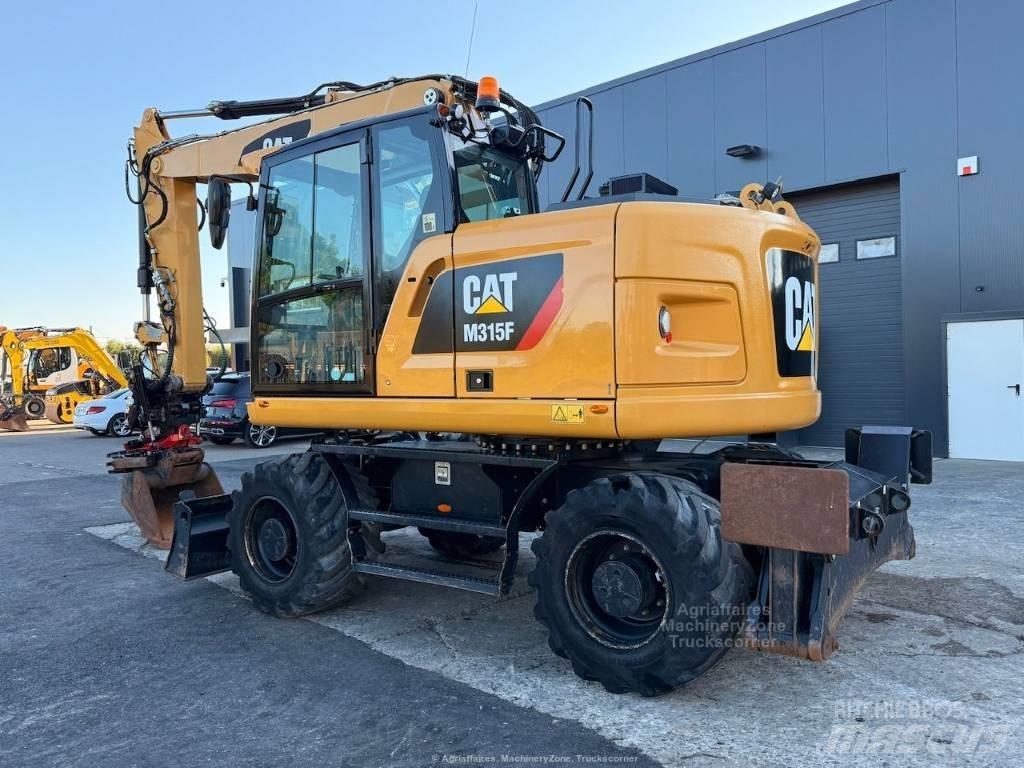 CAT M315F Gumikerekes kotrók