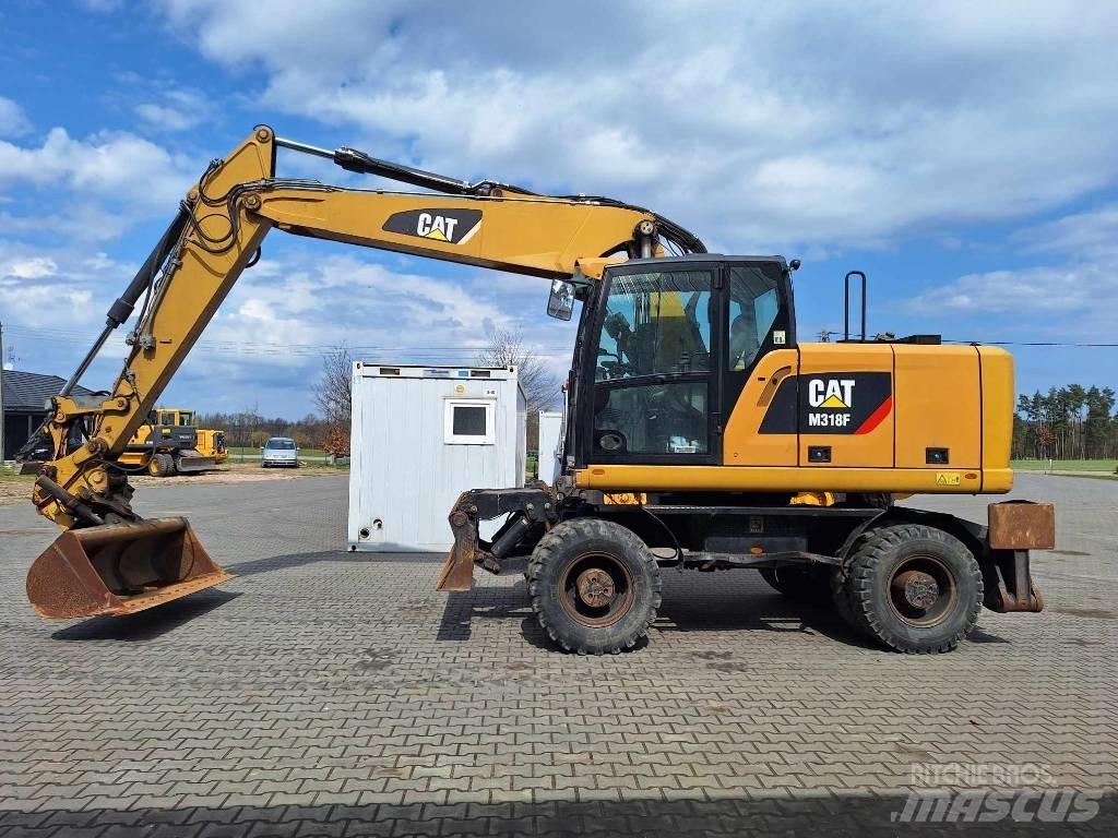 CAT M 318 F Gumikerekes kotrók