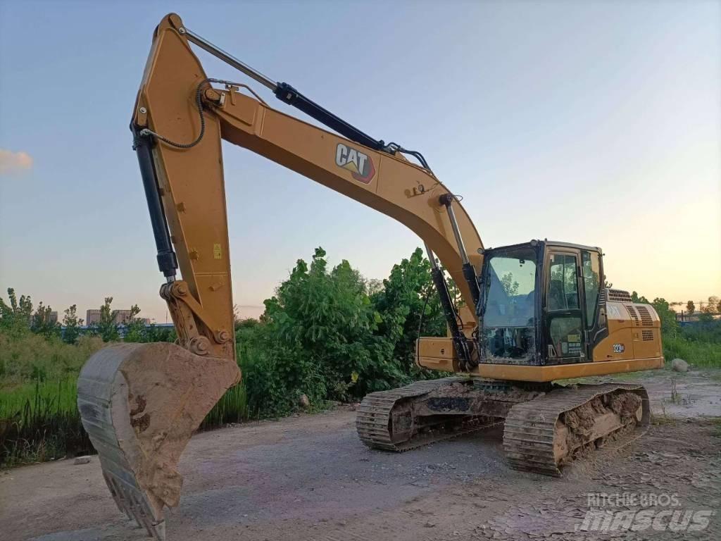 CAT CAT 323GX Kétéltű markolók