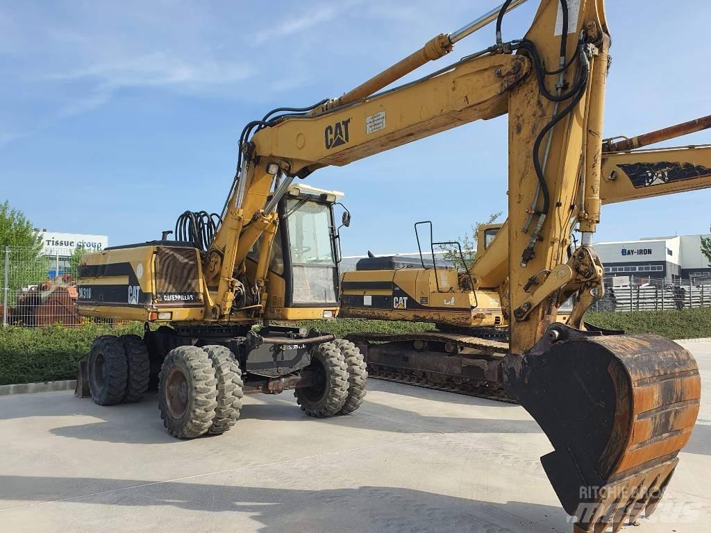 CAT M 318 Gumikerekes kotrók