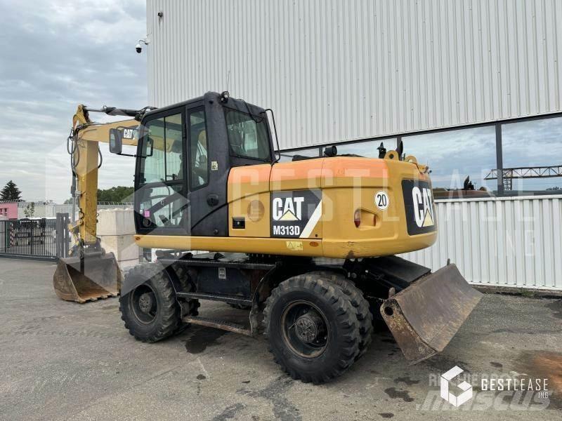 CAT M313D Gumikerekes kotrók