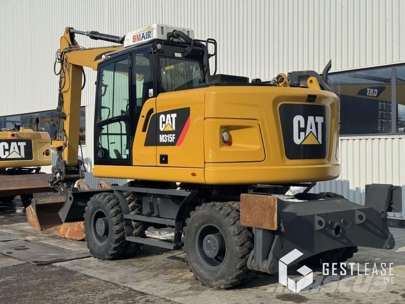 CAT M315F Gumikerekes kotrók