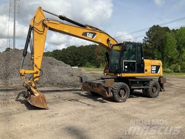 CAT M316D Gumikerekes kotrók