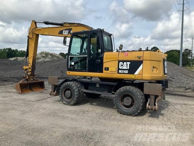 CAT M316D Gumikerekes kotrók