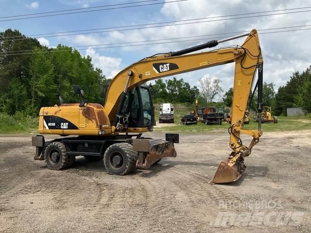 CAT M316D Gumikerekes kotrók