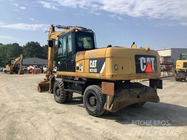 CAT M318D Gumikerekes kotrók