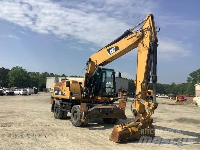 CAT M318D Gumikerekes kotrók