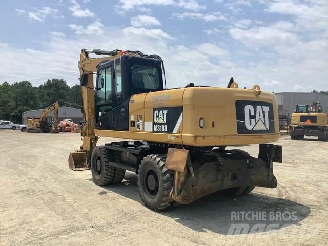 CAT M318D Gumikerekes kotrók
