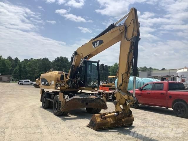 CAT M318D Gumikerekes kotrók