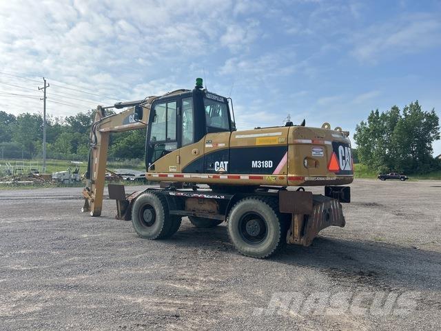 CAT M318D Gumikerekes kotrók