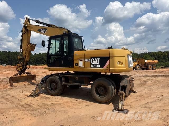 CAT M318D Gumikerekes kotrók