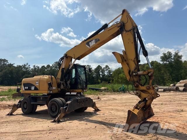 CAT M318D Gumikerekes kotrók