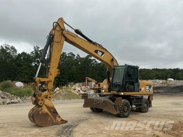 CAT M318D Gumikerekes kotrók