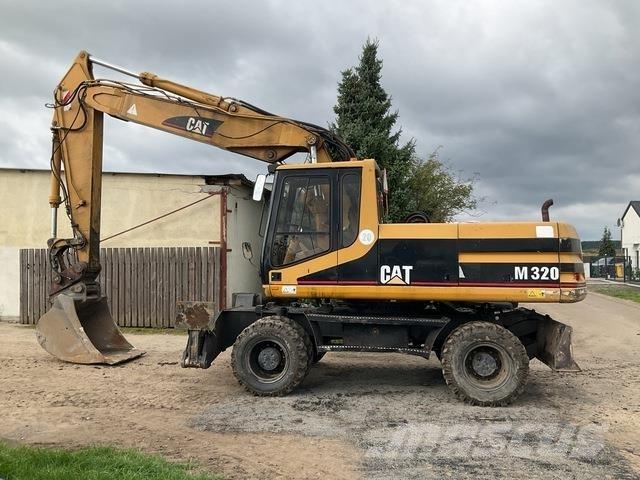 CAT M320 Gumikerekes kotrók