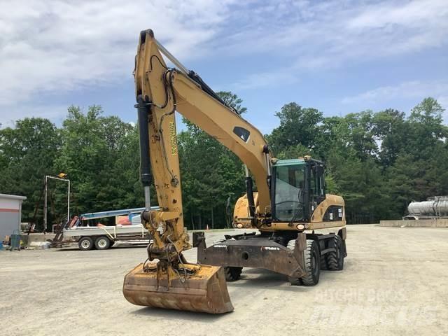 CAT M322D Gumikerekes kotrók
