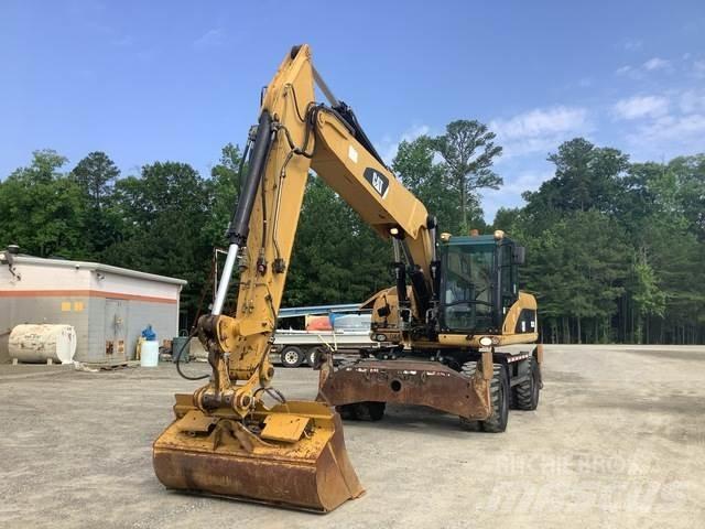 CAT M322D Gumikerekes kotrók