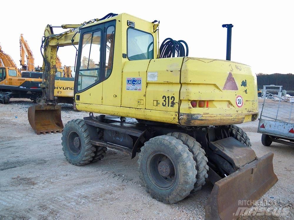 CAT M312 Gumikerekes kotrók