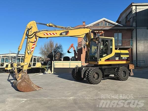 CAT M315 Gumikerekes kotrók