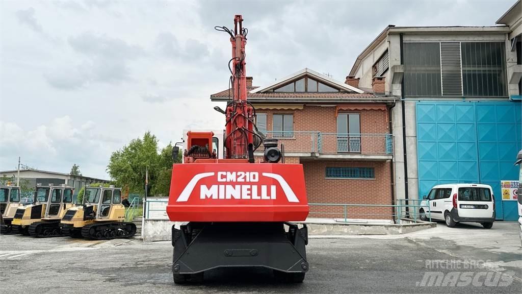 Minelli CM210 Gumikerekes kotrók
