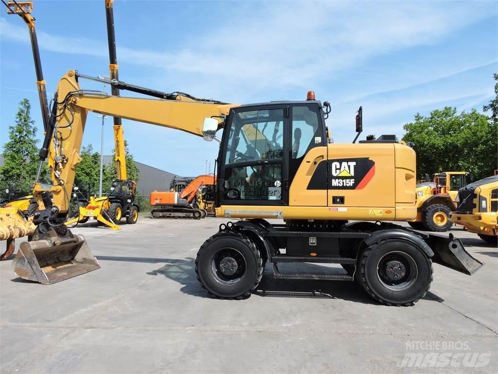 CAT M315F Gumikerekes kotrók
