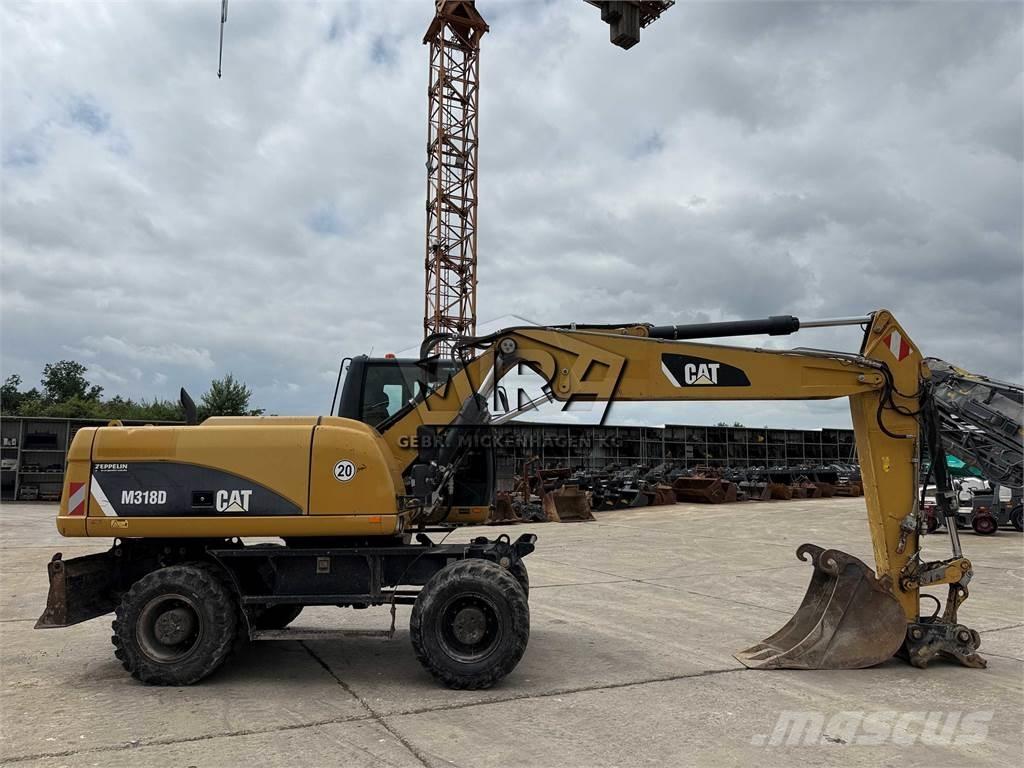 CAT M 318 D Gumikerekes kotrók