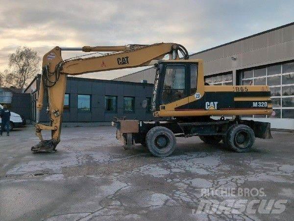 CAT M320 Gumikerekes kotrók
