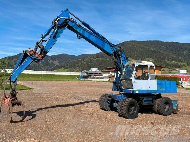 Fuchs 713 Gumikerekes kotrók