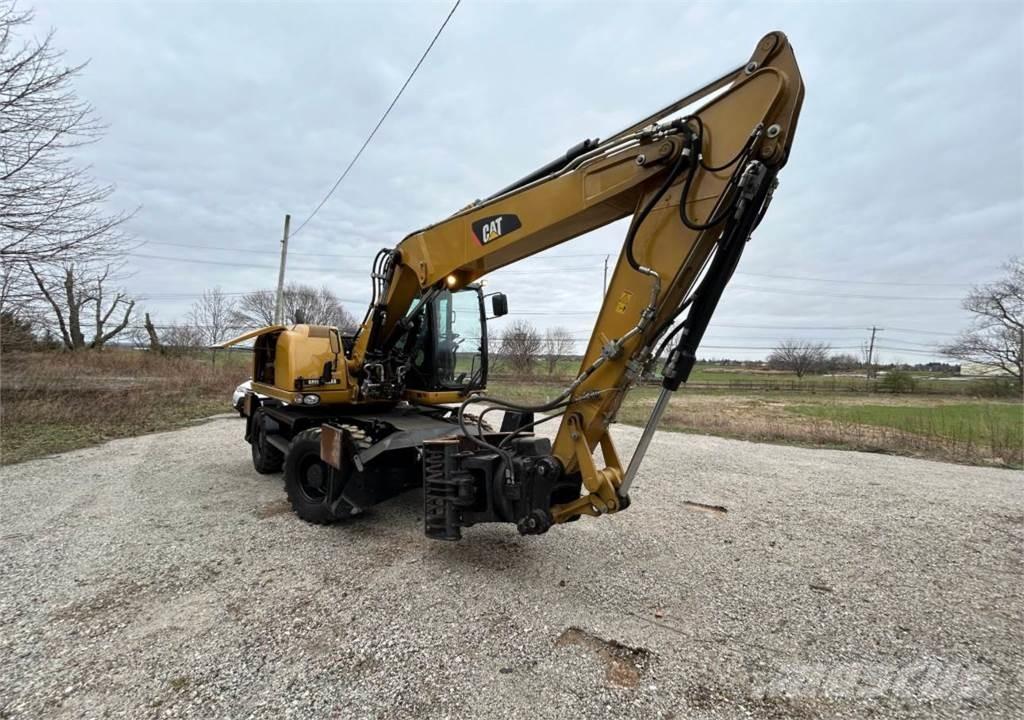 CAT M313D Gumikerekes kotrók