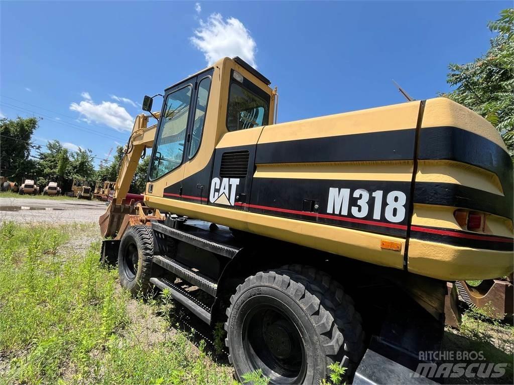 CAT M318 Gumikerekes kotrók