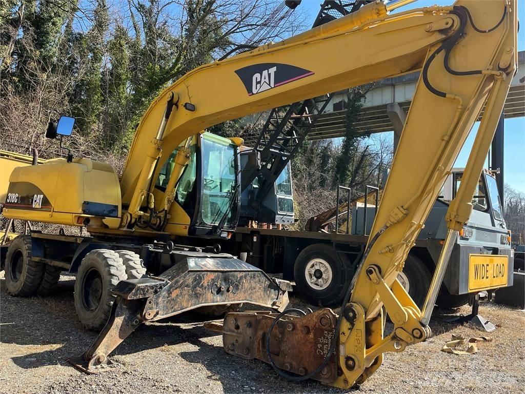 CAT M318C Gumikerekes kotrók