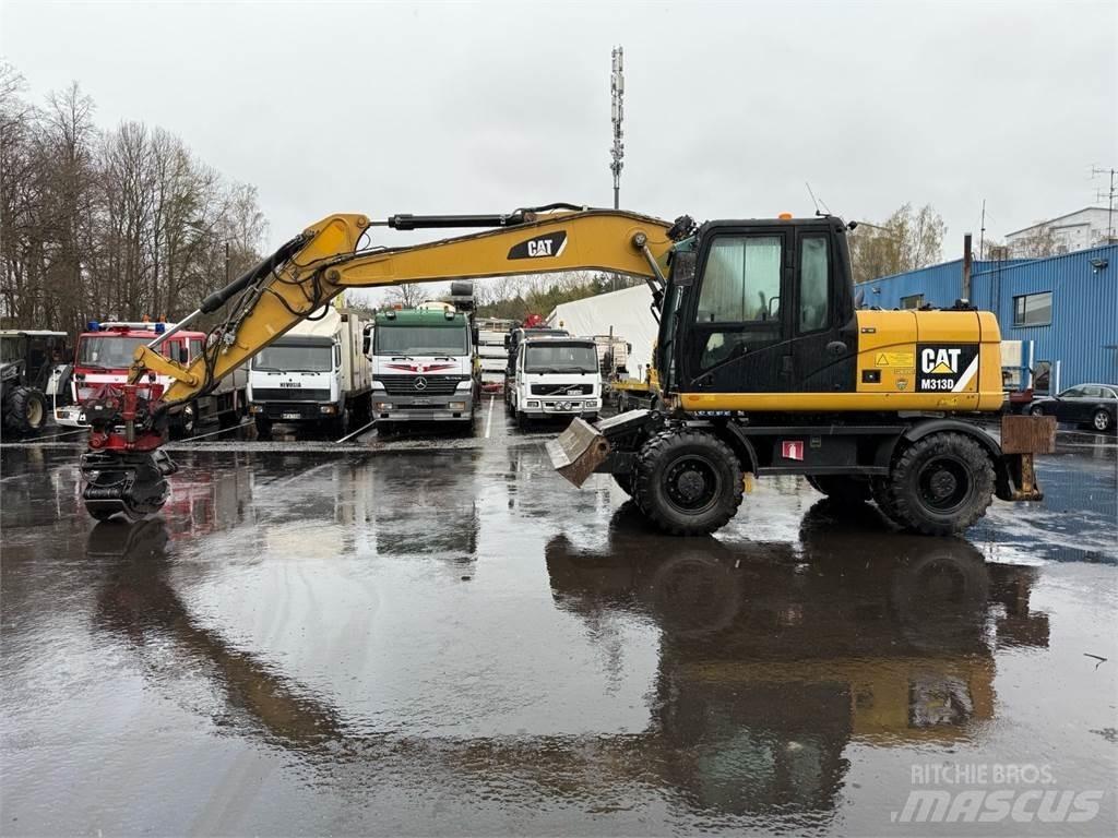 CAT M313 D Gumikerekes kotrók