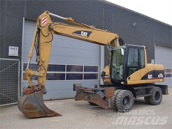 CAT M315C Gumikerekes kotrók